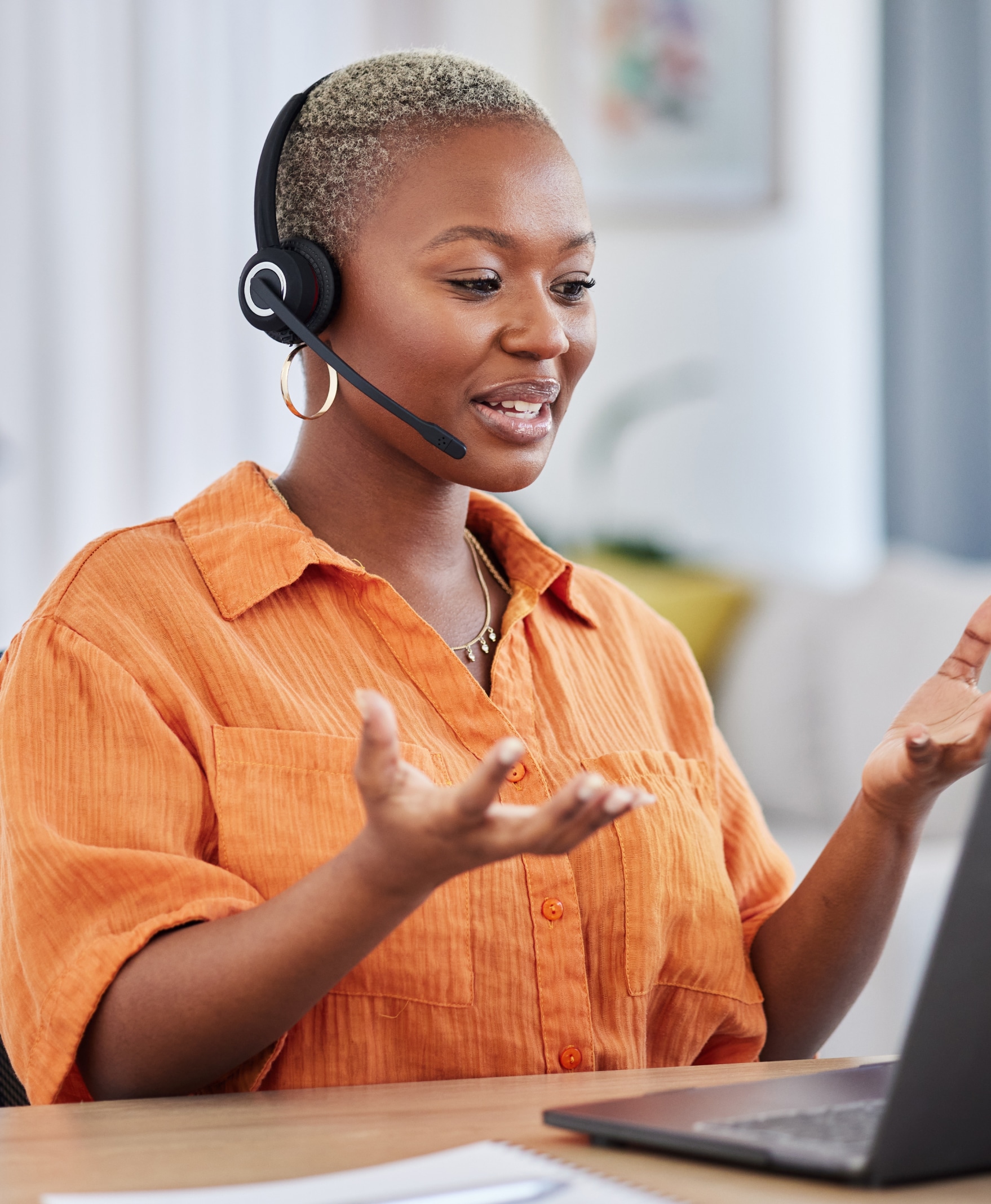 Woman taking a call on her headset